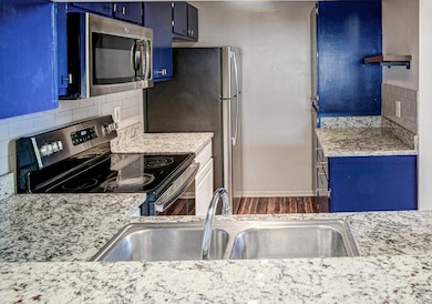Kitchen with decorative backsplash, light counter