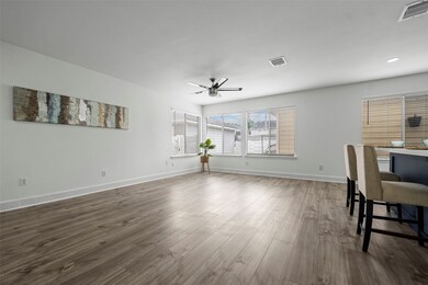 Bright living area with large windows.