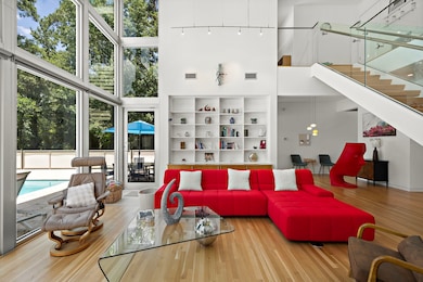 Stylish dining area with dramatic ceilings and flo