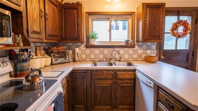 The efficient kitchen boasts abundant cabinetry an