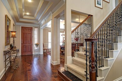 Elegant entry with Hardwood floors, fluted colums,