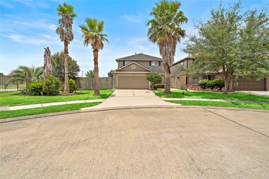 Palms lining the driveway tucked into a quiet cul-de-sac. Privacy and parking!