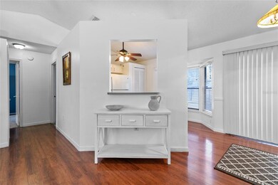 Hall wall and opening to kitchen, dining to the right.