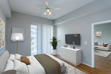 Primary bedroom with lots of natural light with an