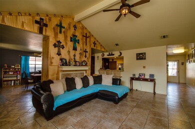 Spacious Den offers a double sided fireplace that extends into the Dining Room.