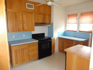 Eat-In Kitchen with KitchenAid Electric Stove and 