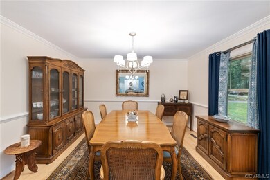 Wood floored dining space featuring a notable chan