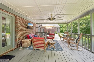 Deck with ceiling fan and outdoor lounge area