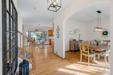 Opens up to Dining Room w/ arched opening and oak hardwood flooring throughout