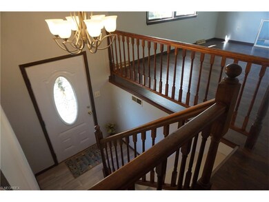 The foyer is graced by a new brushed nickel chande