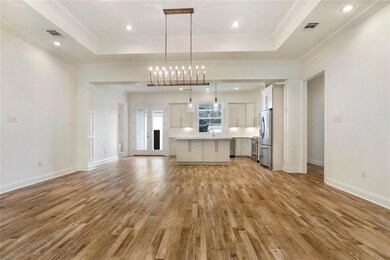 Wood lamanite flooring, high ceilings, can lightin