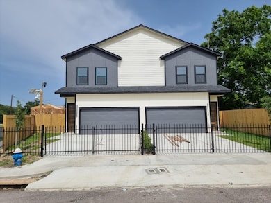 The front view of the duplex with a two-story desi
