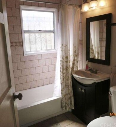 Remodeled full bath, sand stone tile tub surround 