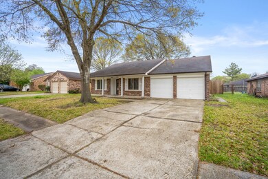 A large mature tree in front offers an abundance of shade to the spacious yard. The utility room is located in the garage with tons of built-in cabinets & a work bench!