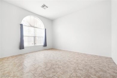 Spare room with tile patterned floors