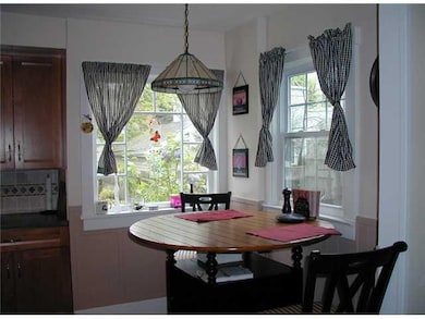 Kitchen. The corner windows allow sun into the kit
