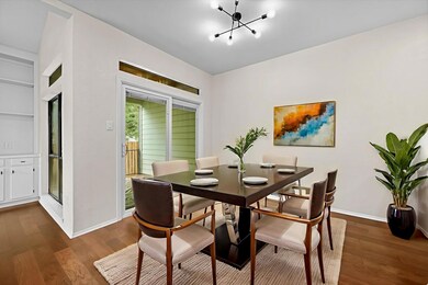Dining space featuring dark wood-type flooring an