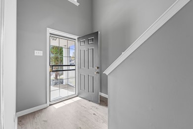 The spacious foyer creates a smooth flow into the living areas, setting the tone for a home that’s both stylish and functional.