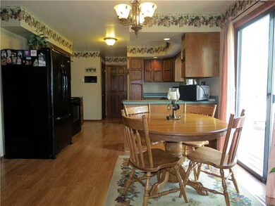 Kitchen. A sliding glass door lends access to the 
