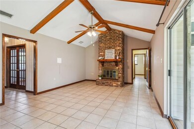 Living Room with Vaulted Ceiling and Wood Burning 
