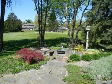Beautifully landscaped retreat in rear of home on 
