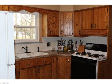 The kitchen has new countertops and a newer sink a
