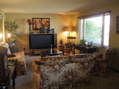 Spacious living room with large picture window.