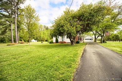 Paved, long circular driveway.