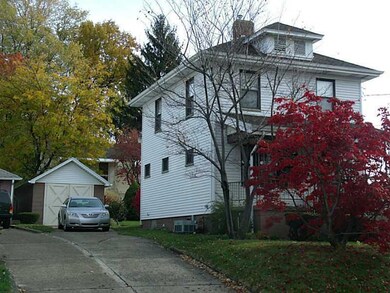 Exterior Front. Side view of home with 1 car detac