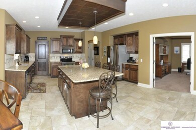 The office opens to the kitchen with beautiful French doors.