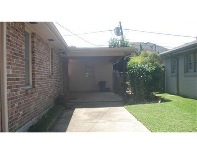Photo. CARPORT WITH LONG DRIVEWAY FROM CURB TO REA