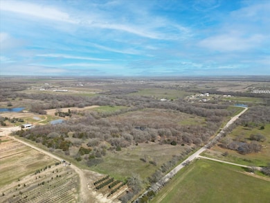 Birds eye view of property featuring a rural view