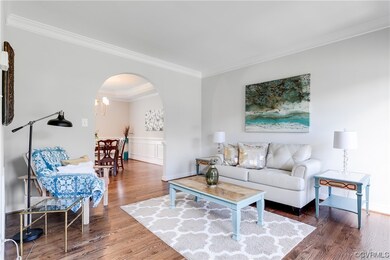 Beautiful living room with archway to dining room