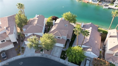 Aerial view of residential area with a nearby body