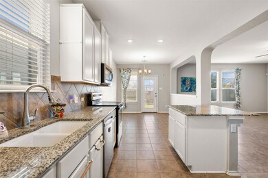 Kitchen featuring stainless steel appliances, a s