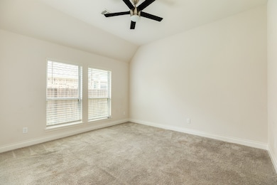 The secondary bedroom faces the front of the home.