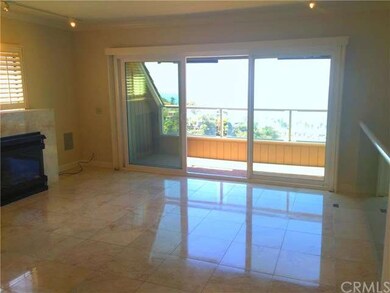 Living room with fireplace leads out to view deck