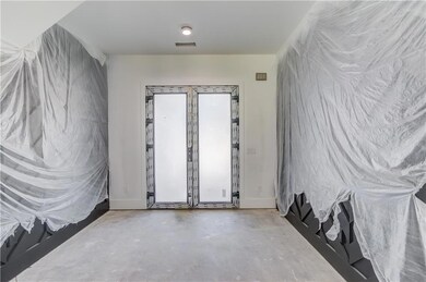 Unfurnished room with concrete floors