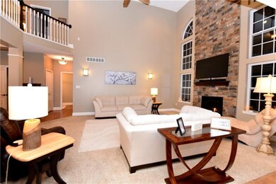floor to ceiling stone fireplace outlined with pre