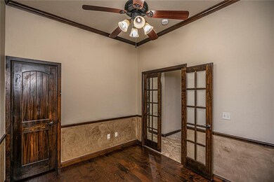 Study with closet and wood flooring