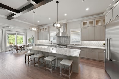 Gorgeous kitchen with Quartz counters, plenty of storage, soft closing cabinets/drawers, custom drawers/pull outs - so much to love here.
