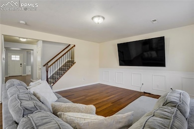 The open floor plan boasts multiple living spaces,