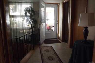 Leading into the 1st floor half bath, sun room and