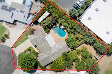 Over view of the home with the large lot and orcha