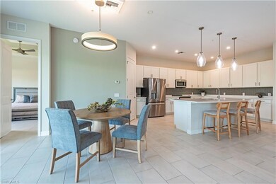 Kitchen with decorative backsplash, visible vents,