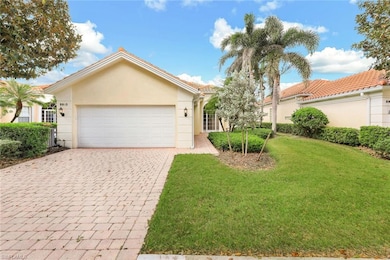 View of front of house with a garage and a front l