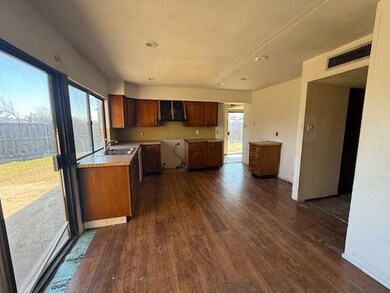 Kitchen with visible vents, light countertops, bro