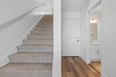 Staircase featuring wood finished floors and baseboards