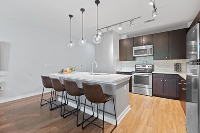 Kitchen with light wood finished floors, light co