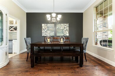 Formal living opens to custom built butler’s pantry and kitchen.